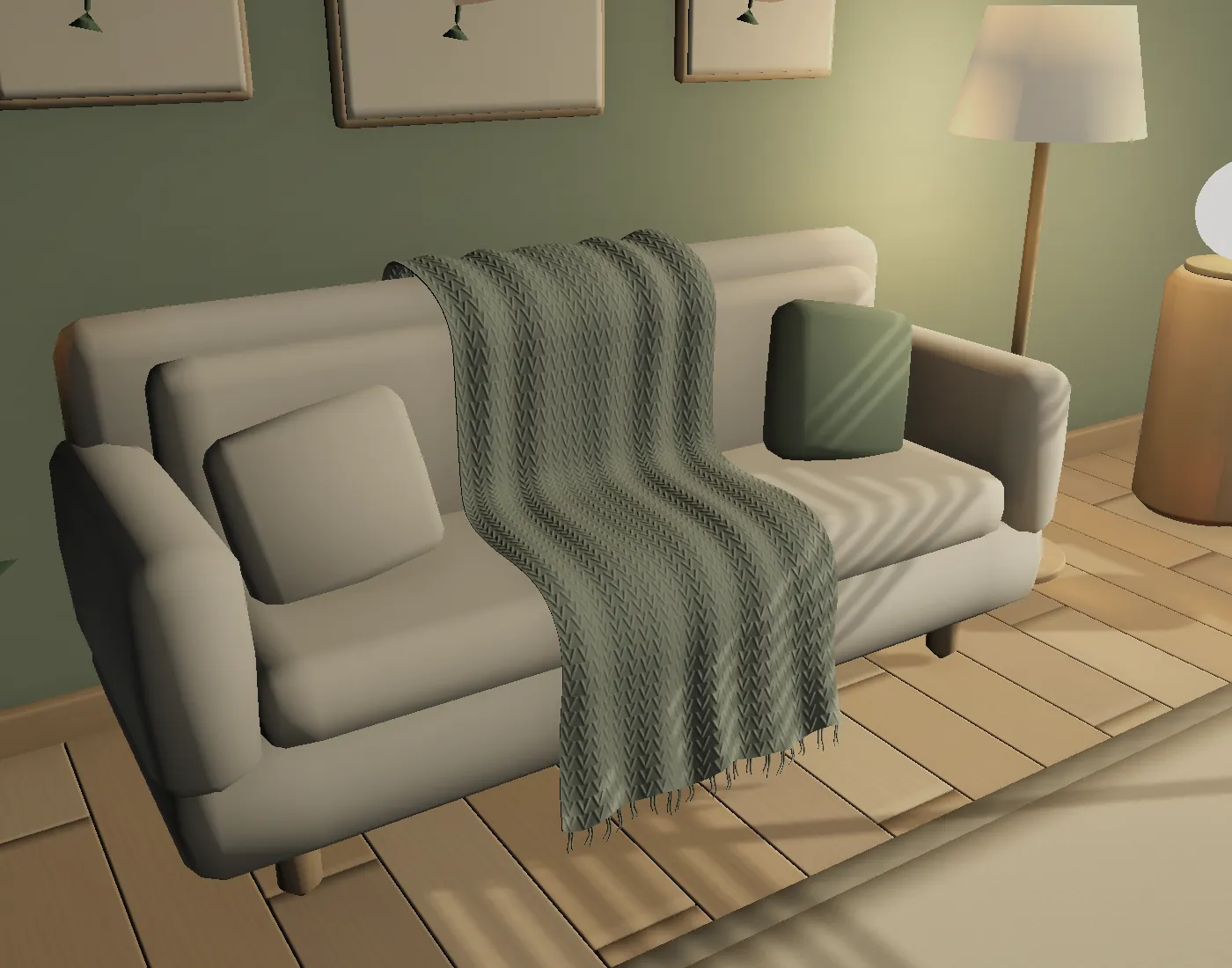 Close-up of the knitted chevron blanket draped across the sofa.